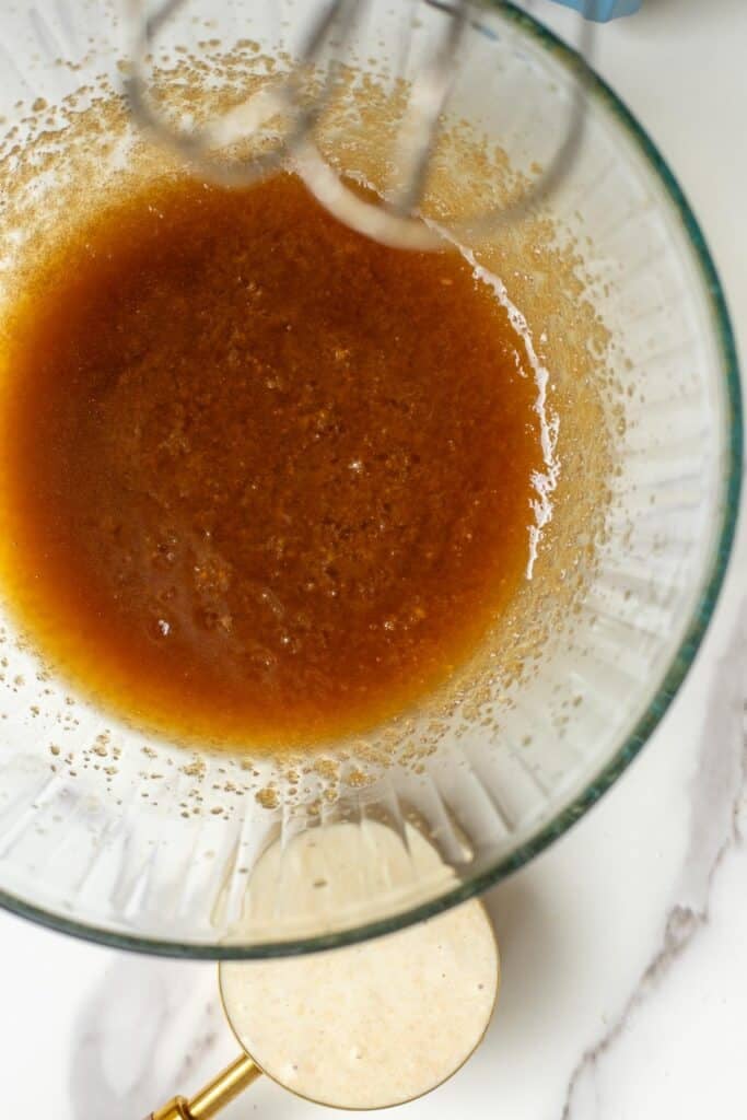 brown sugar and melted butter whisked together in a glass bowl.