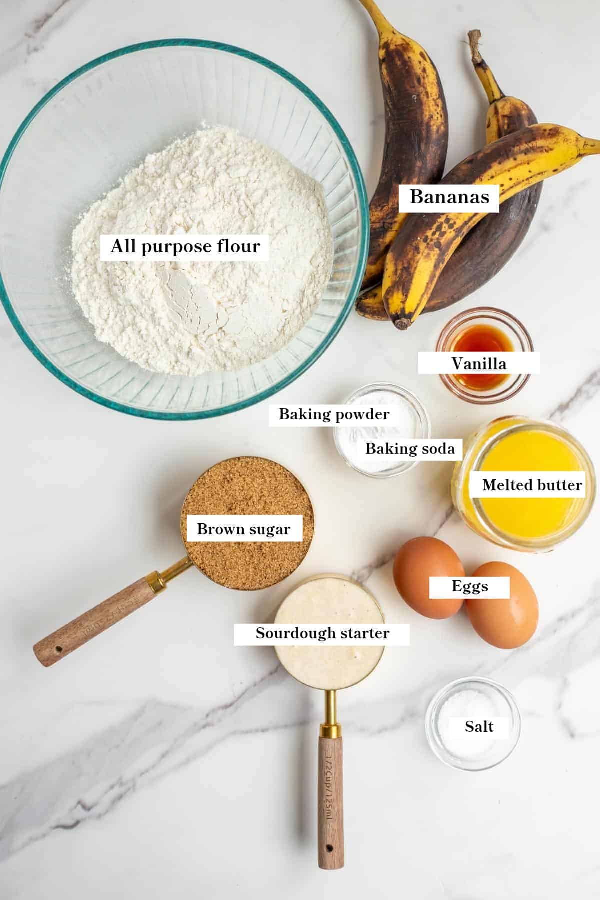 individual ingredients in bowls on the counter to make sourdough banana bread.